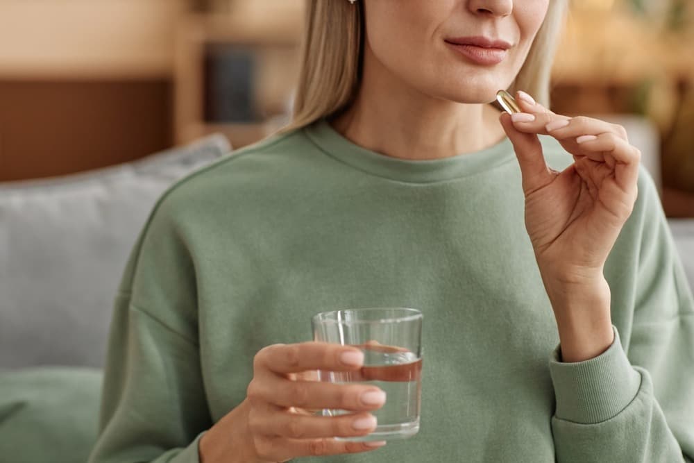 Patient taking vitamins with water