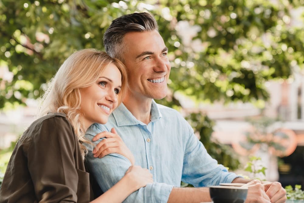 Couple sitting together outdoors